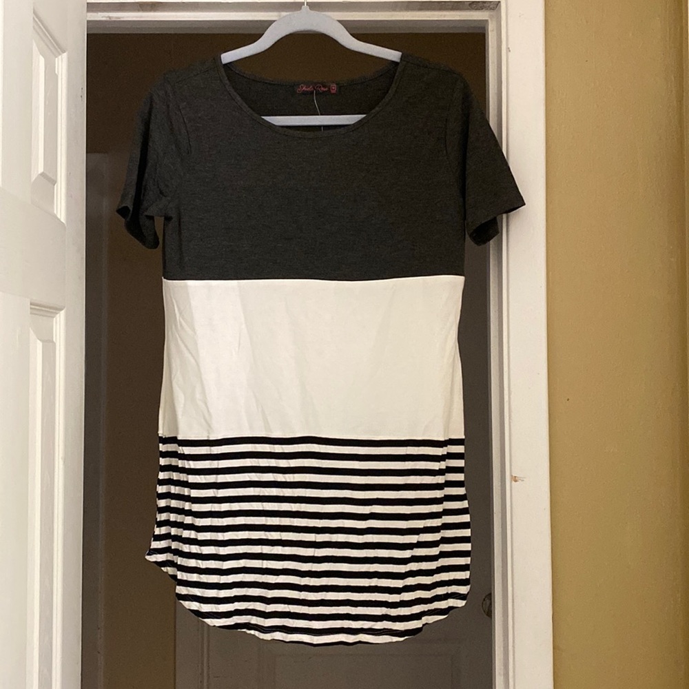 Gray and white shirt with a black and white striped bottom